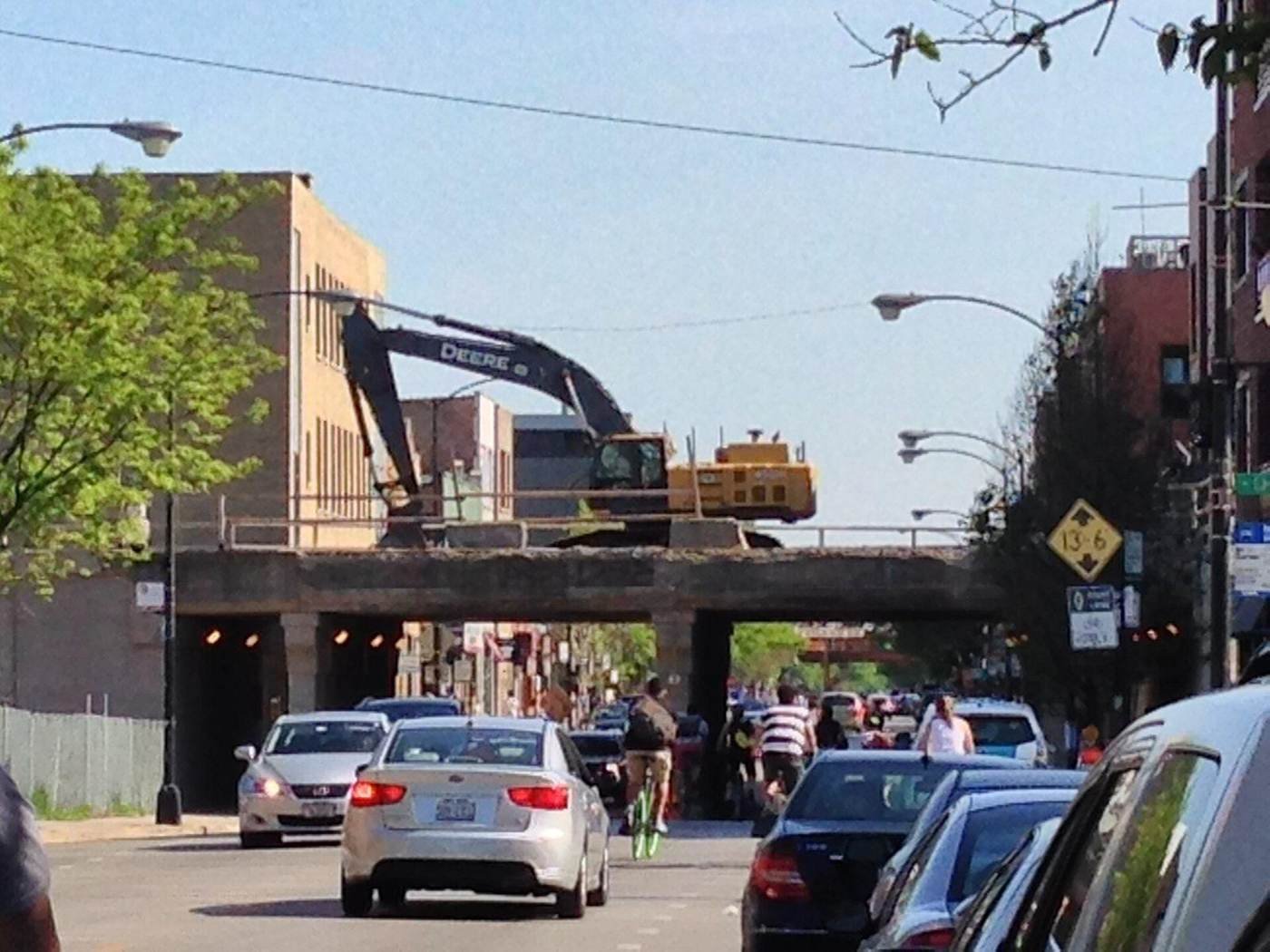 Excavator rebuilding a rail bridge for the Bloomingdale Trail on Chicago's Northwest Side