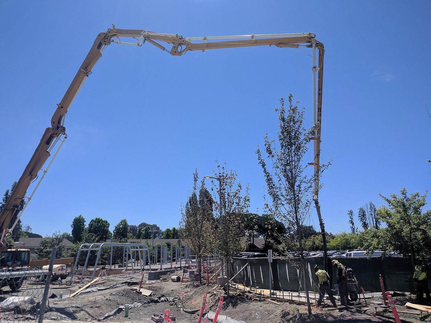 Concrete boom pump placing a foundation pour, the scope we quantify in concrete takeoffs