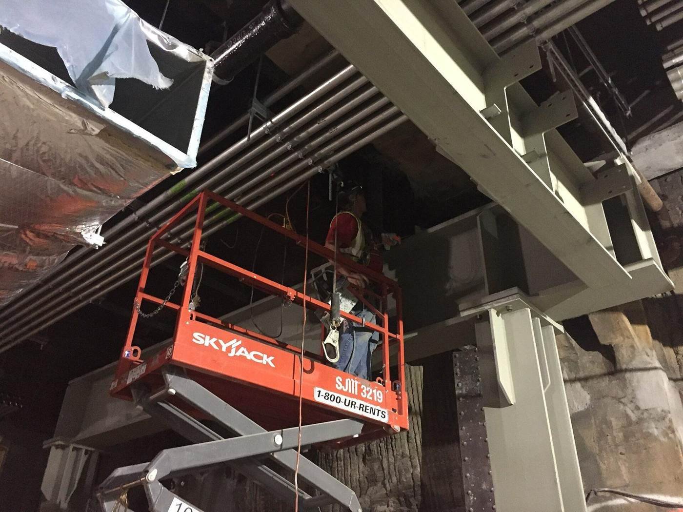 Ironworkers setting structural steel beams, a trade covered in our steel takeoffs
